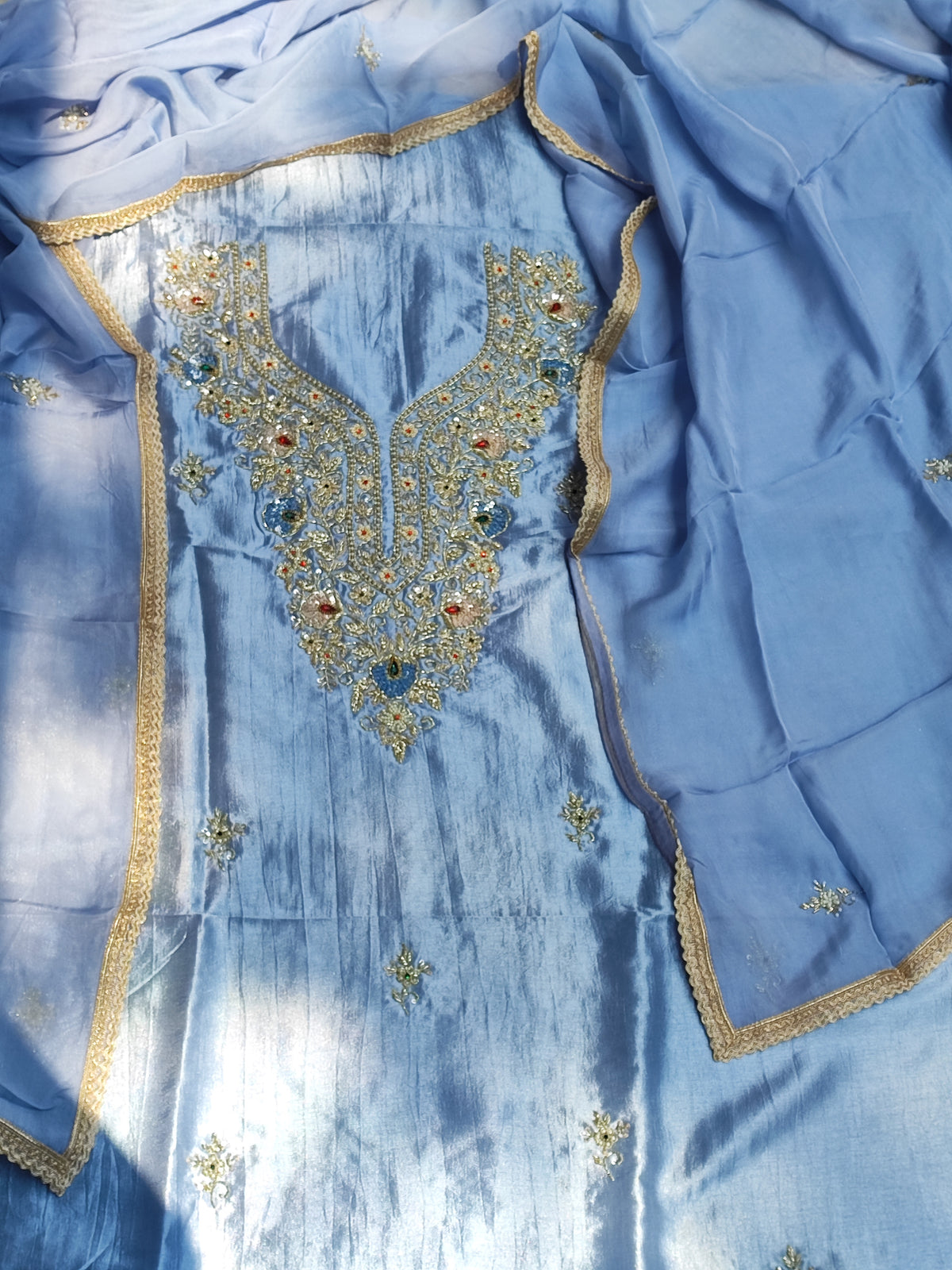 Blue Russian silk suit set with hand-embroidered organza dupatta and gota border