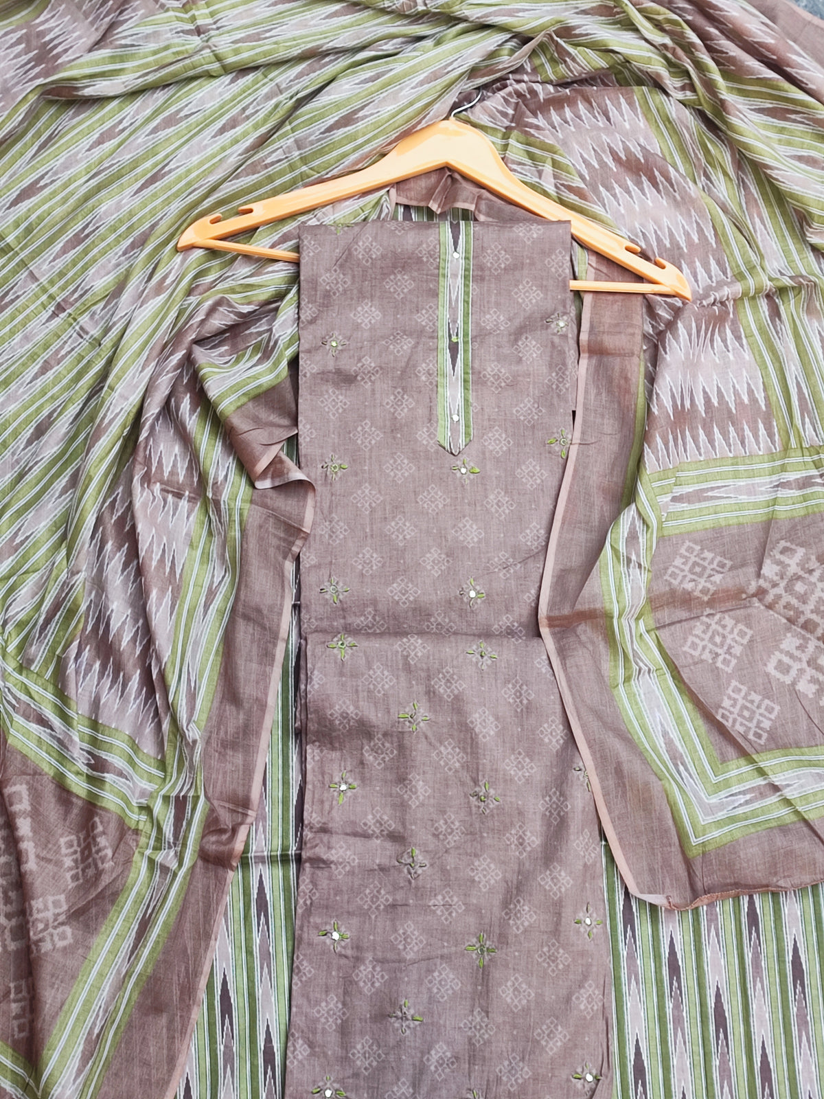Close-up of patra and green thread work motif on mouse grey cotton