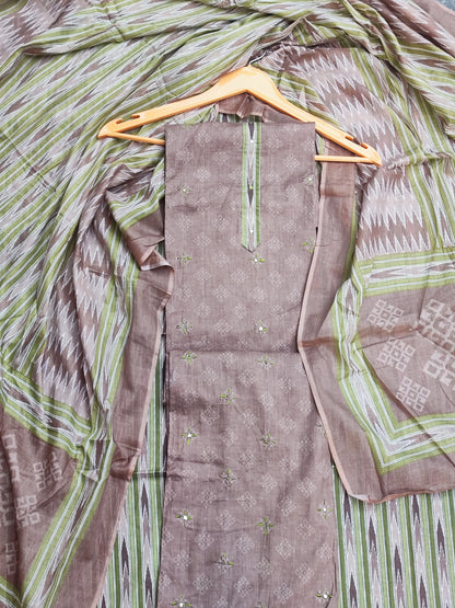 Close-up of patra and green thread work motif on mouse grey cotton