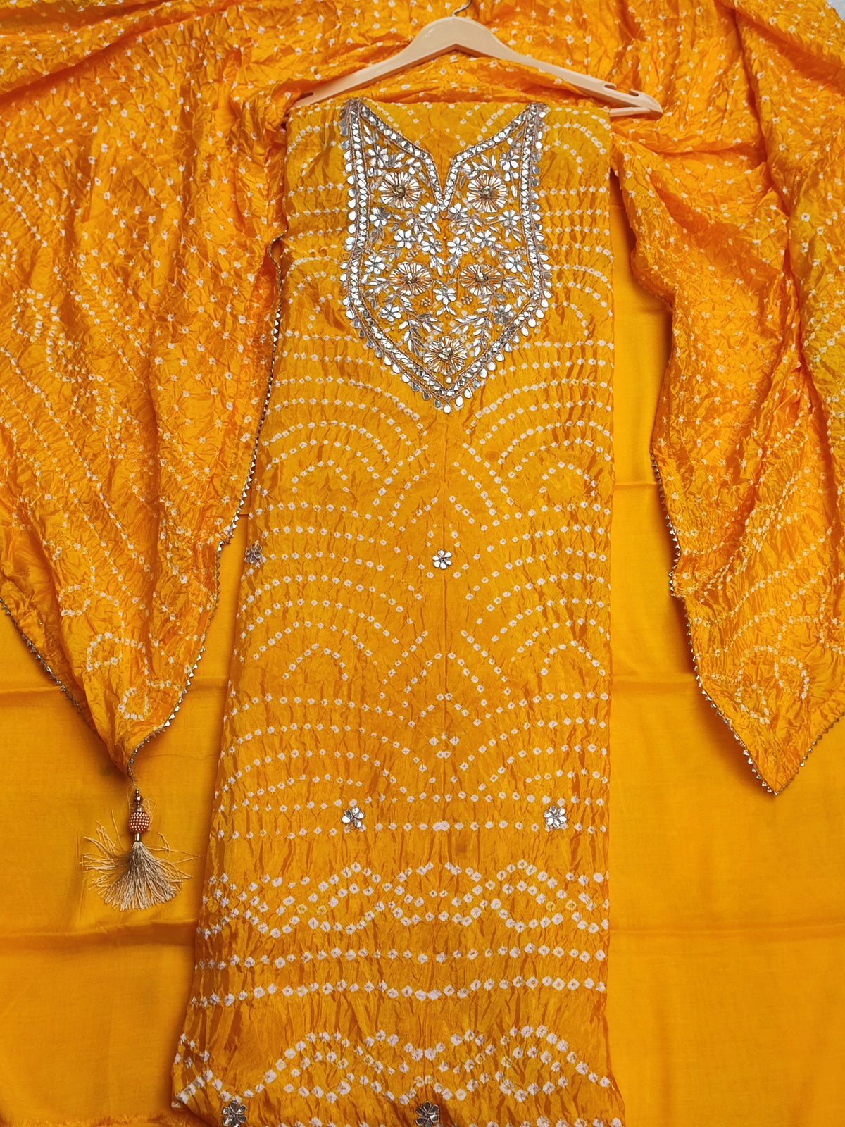 Close-up of gota patti neckline panel on yellow bandhani shirt