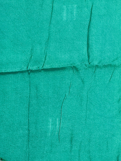 Bandhani tie-dye detail in bottle green with white and pale blue dots