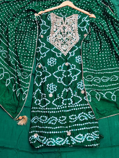 Close-up of gota patti neckline with pearl clusters on bottle green bandhani